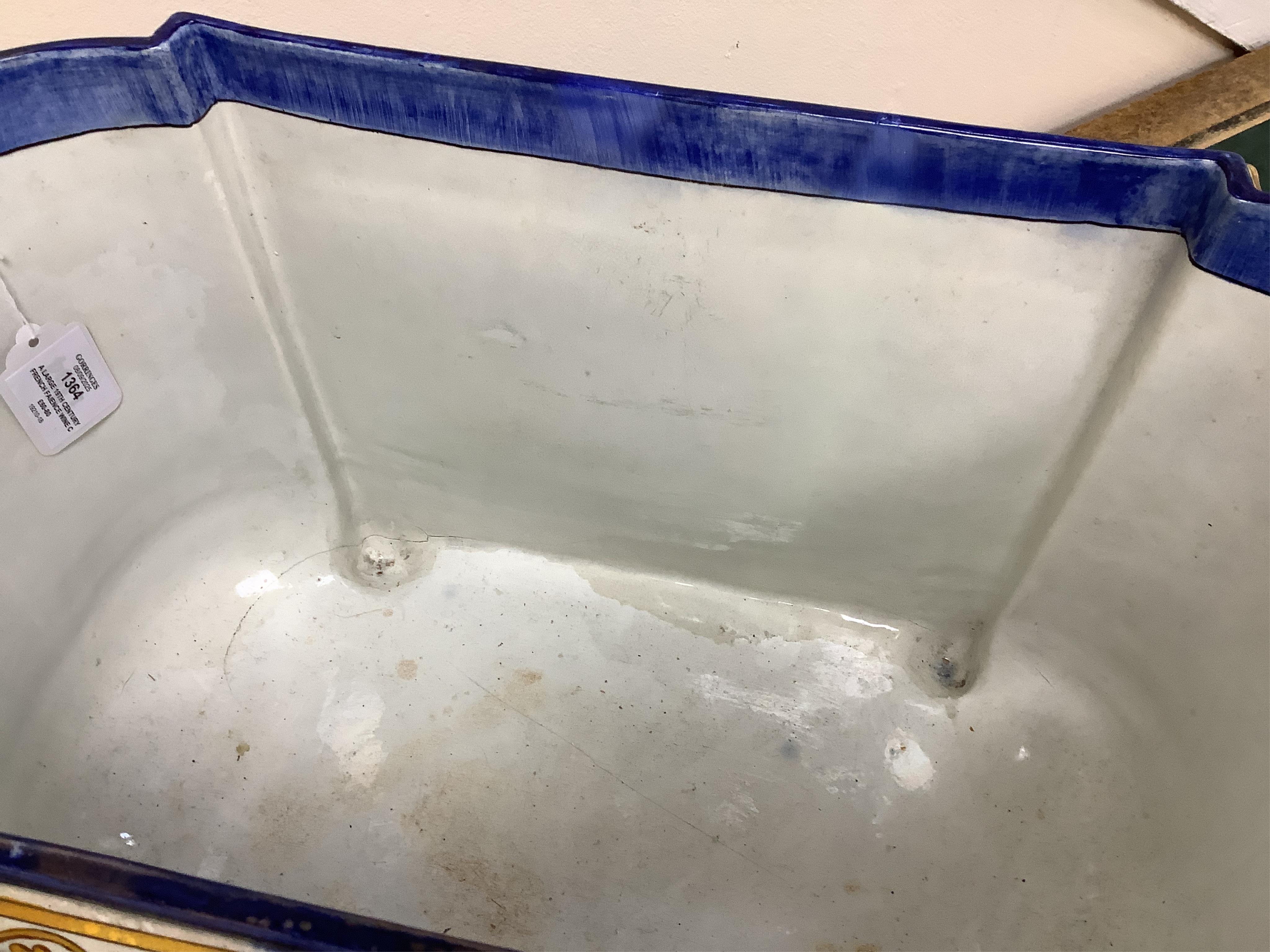A large 19th century French faience wine cooler or planter with ram’s head handles, 60cm wide